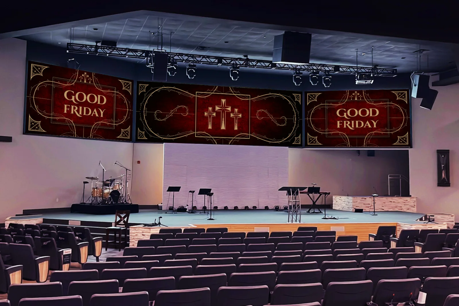 Christ Fellowship Church sanctuary with custom Good Friday stage banner graphics featuring ornate gold typography and three crosses on a deep red background