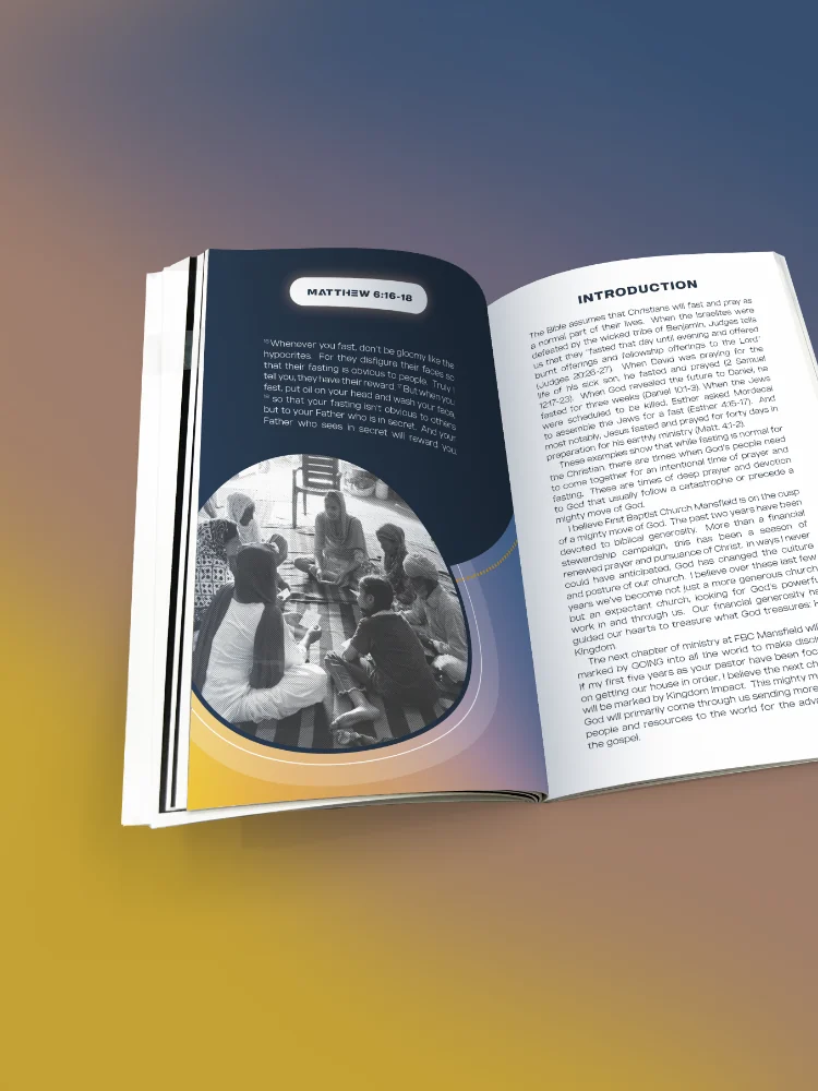 40 Days of Prayer book opened to the Matthew 28:18 opening spread, with a navy curved panel framing a circular photo of people gathered in fellowship, paired with the introduction page