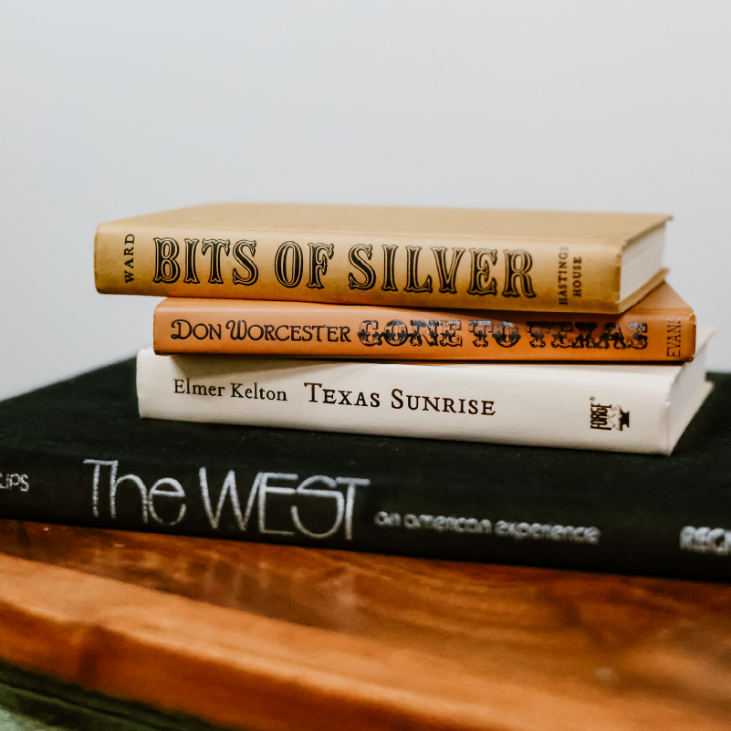 Stack of Western literature books including Bits of Silver, Gone to Texas, and Texas Sunrise