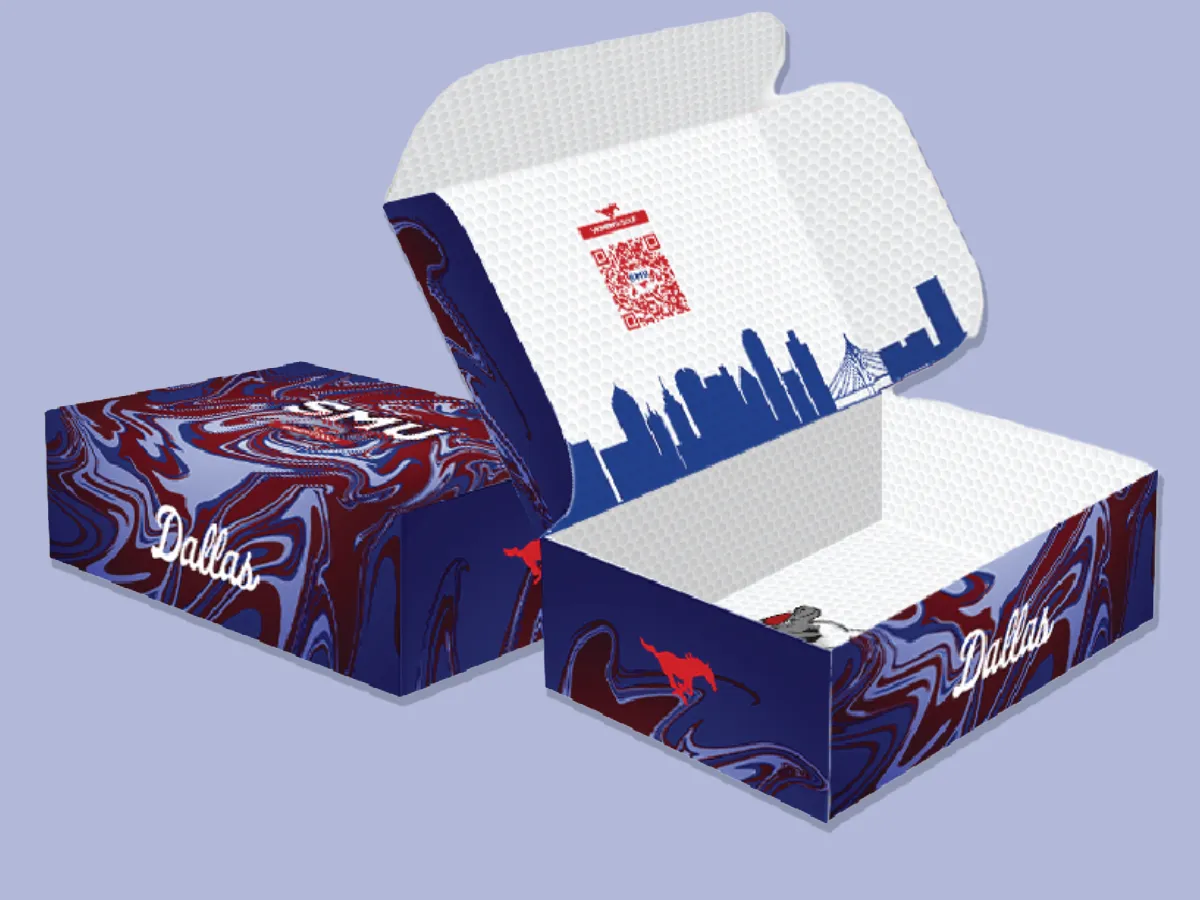Custom SMU women's golf merchandise box with marbled blue and red exterior, 'Dallas' wordmark, mustang silhouette, and Dallas skyline interior