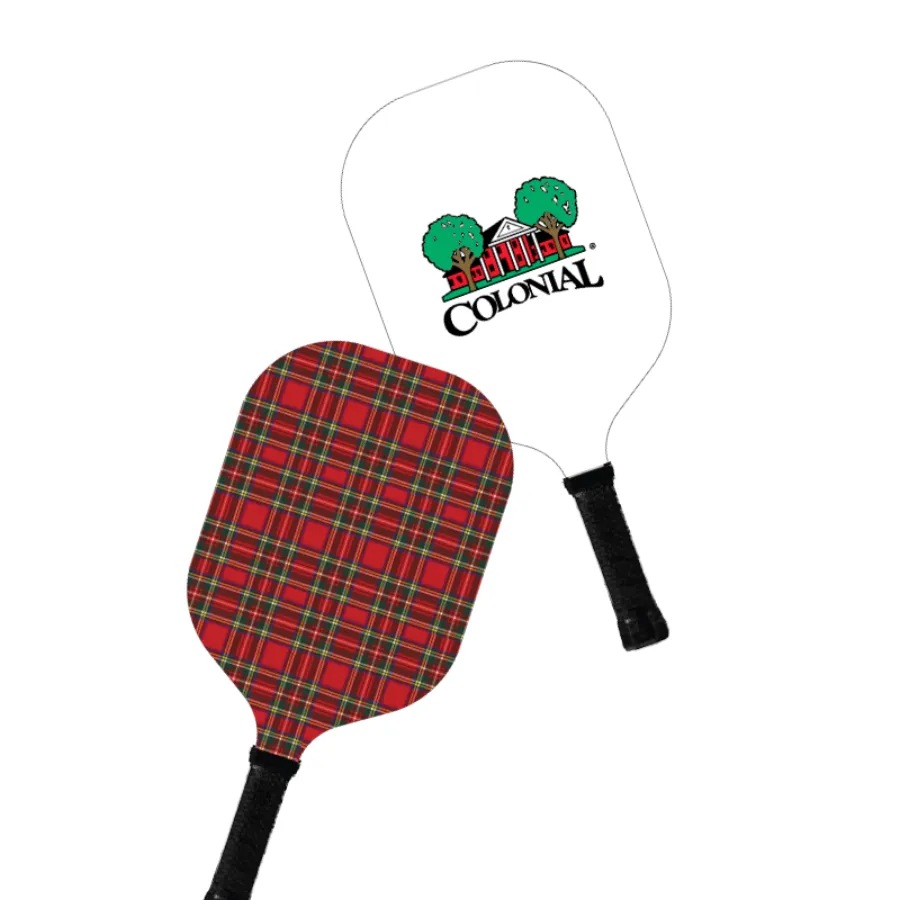 Colonial Country Club pickleball paddles: a red plaid paddle and a white paddle with the Colonial trees and clubhouse logo
