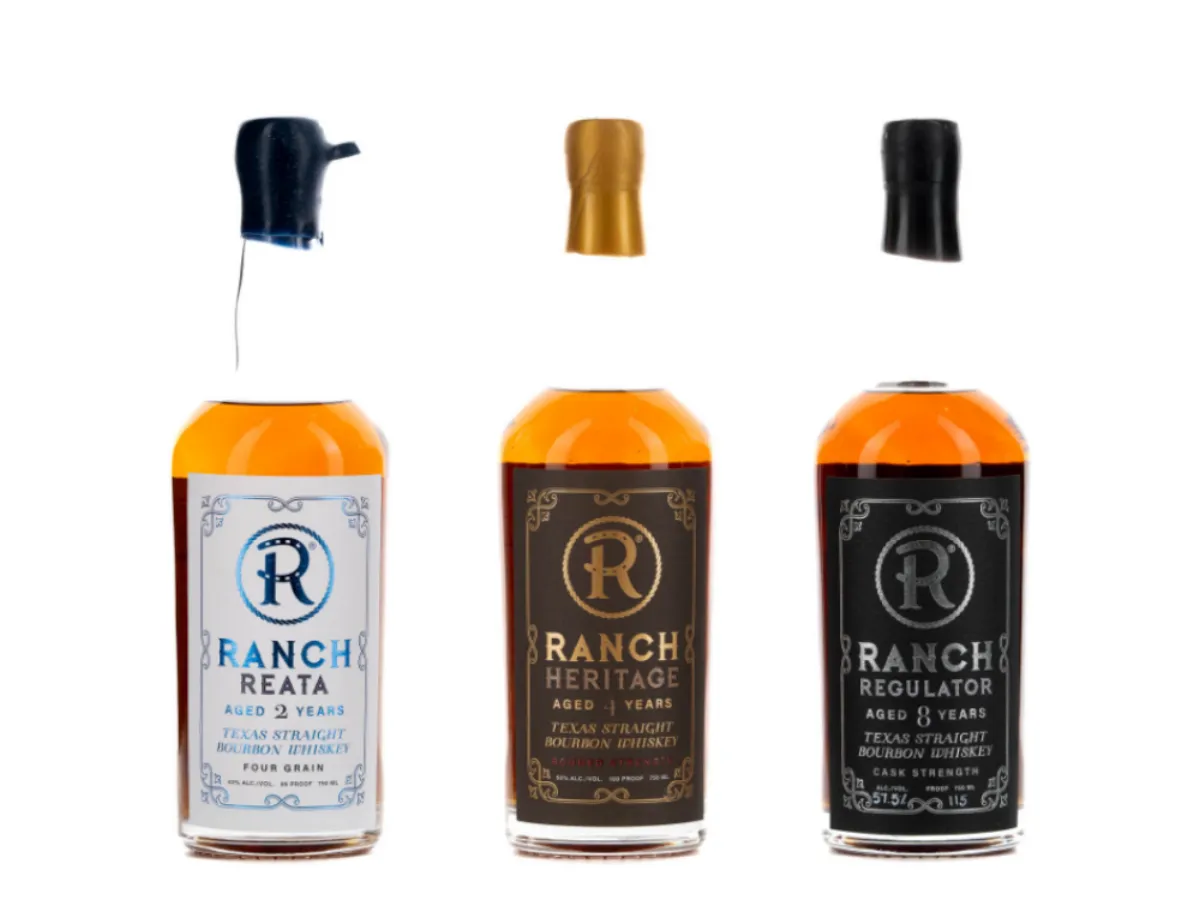 Ranch Whiskey series: Reata, Heritage, and Regulator Texas straight bourbon whiskey bottles with their wax-sealed caps floating above