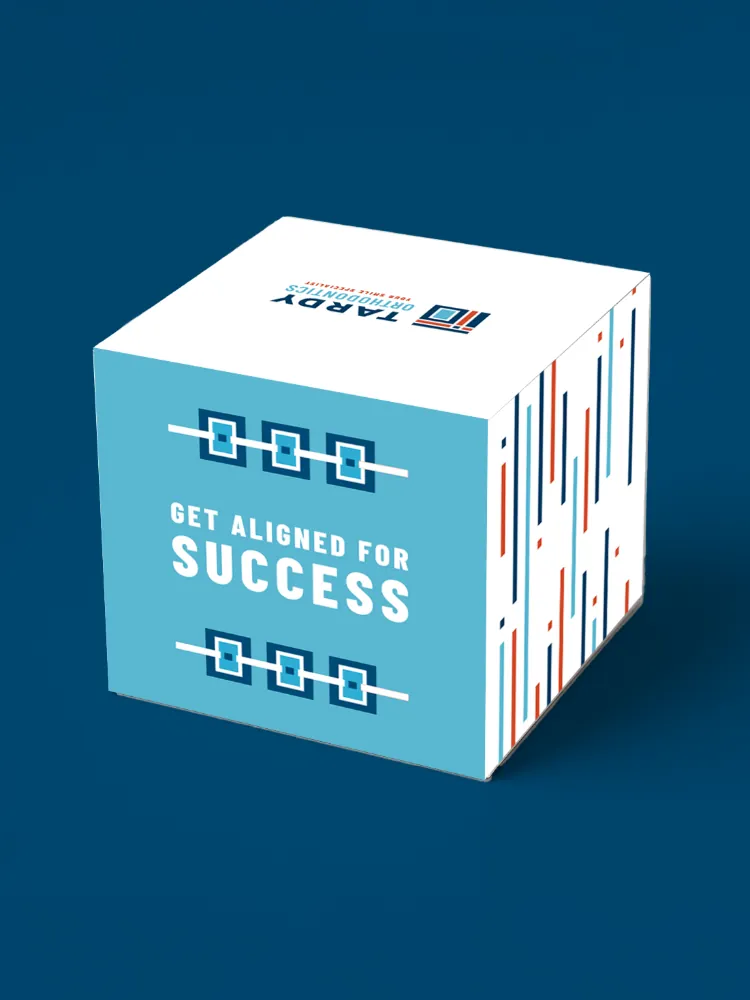 Custom Tardy Orthodontics 'Get Aligned for Success' new patient swag box with the three-bracket icon design in navy and teal